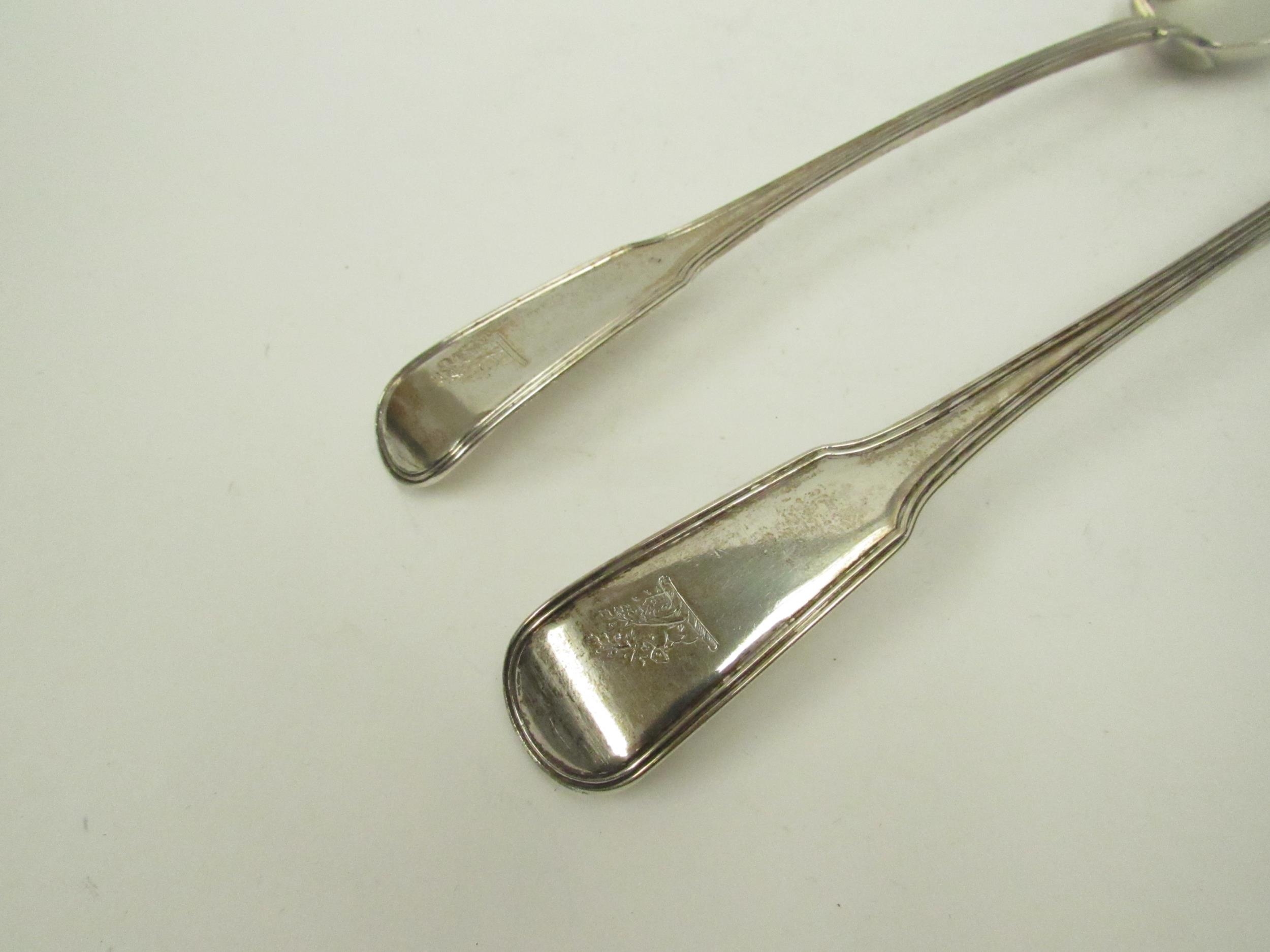 A pair of William Sumner I silver basting / stuffing spoons, family crest to terminal, London - Image 2 of 4