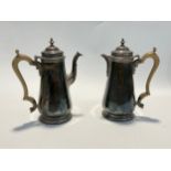 A C.J. Vander Ltd silver coffee pot and matching hot water jug in the 18th Century style, treen