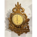 A 19th Century French cartel clock with Arabic numerals to the cream face, within a gilded