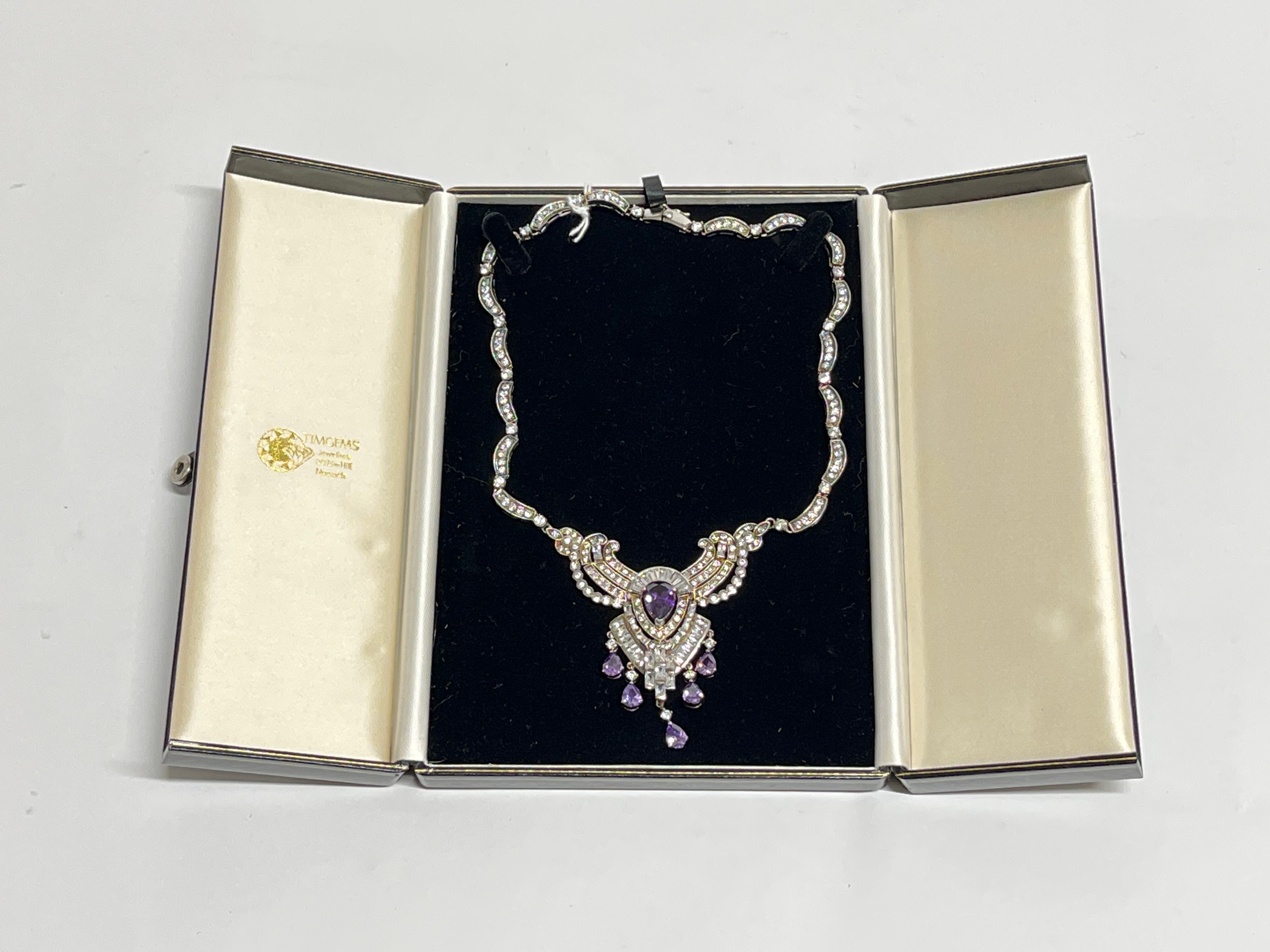 An Art Deco style statement necklace, multi set with brilliant purple and white stones, stamped 925