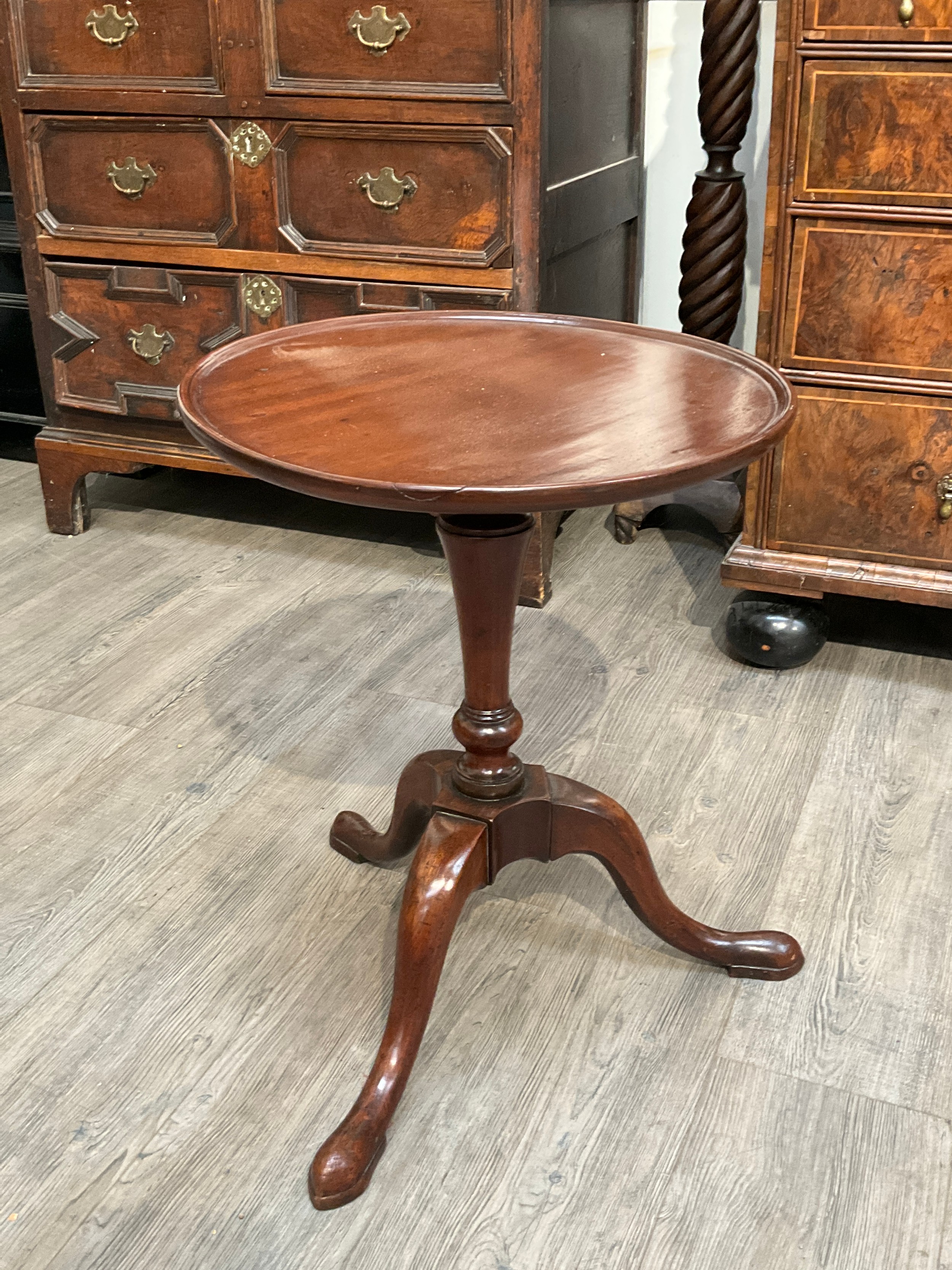 A George III Cuban mahogany wine table with vase form stem, quatraform base, 56cm tall x 44cm