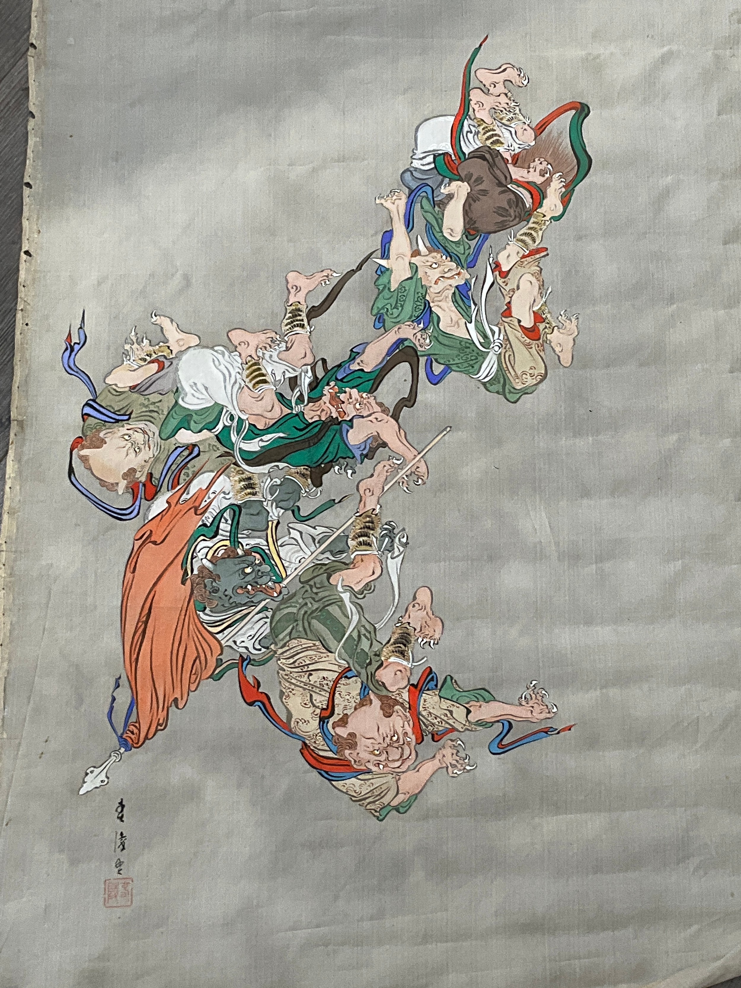 An Oriental handpainted silk display of a battle scene, unframed, 132cm x 59cm