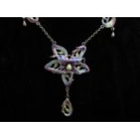 An Art Nouveau style silver and enamel flower necklace with droplets