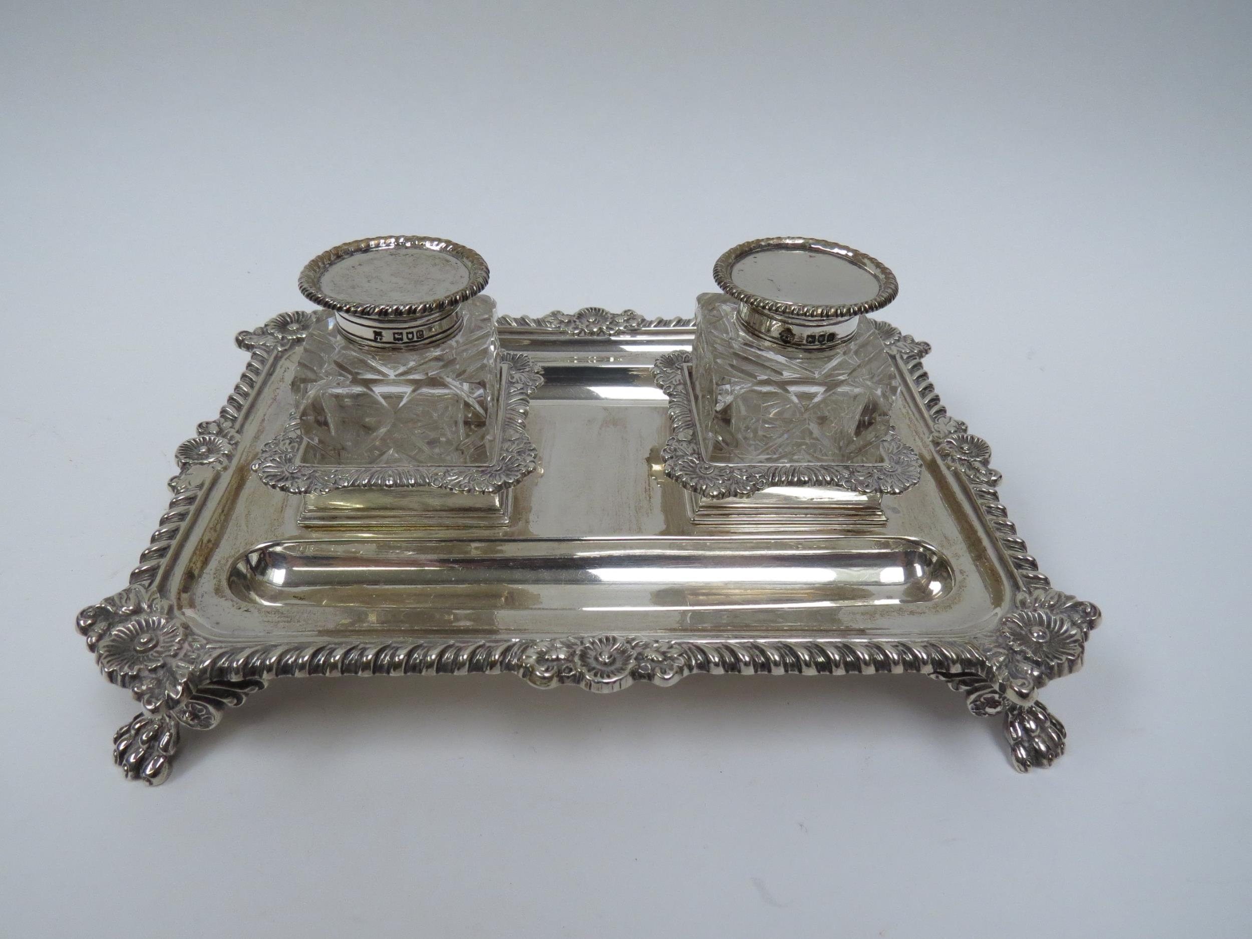 A Thomas Bradbury & Sons silver twin bottled inkstand with double pen holder, wrythen and floral