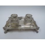 A Thomas Bradbury & Sons silver twin bottled inkstand with double pen holder, wrythen and floral