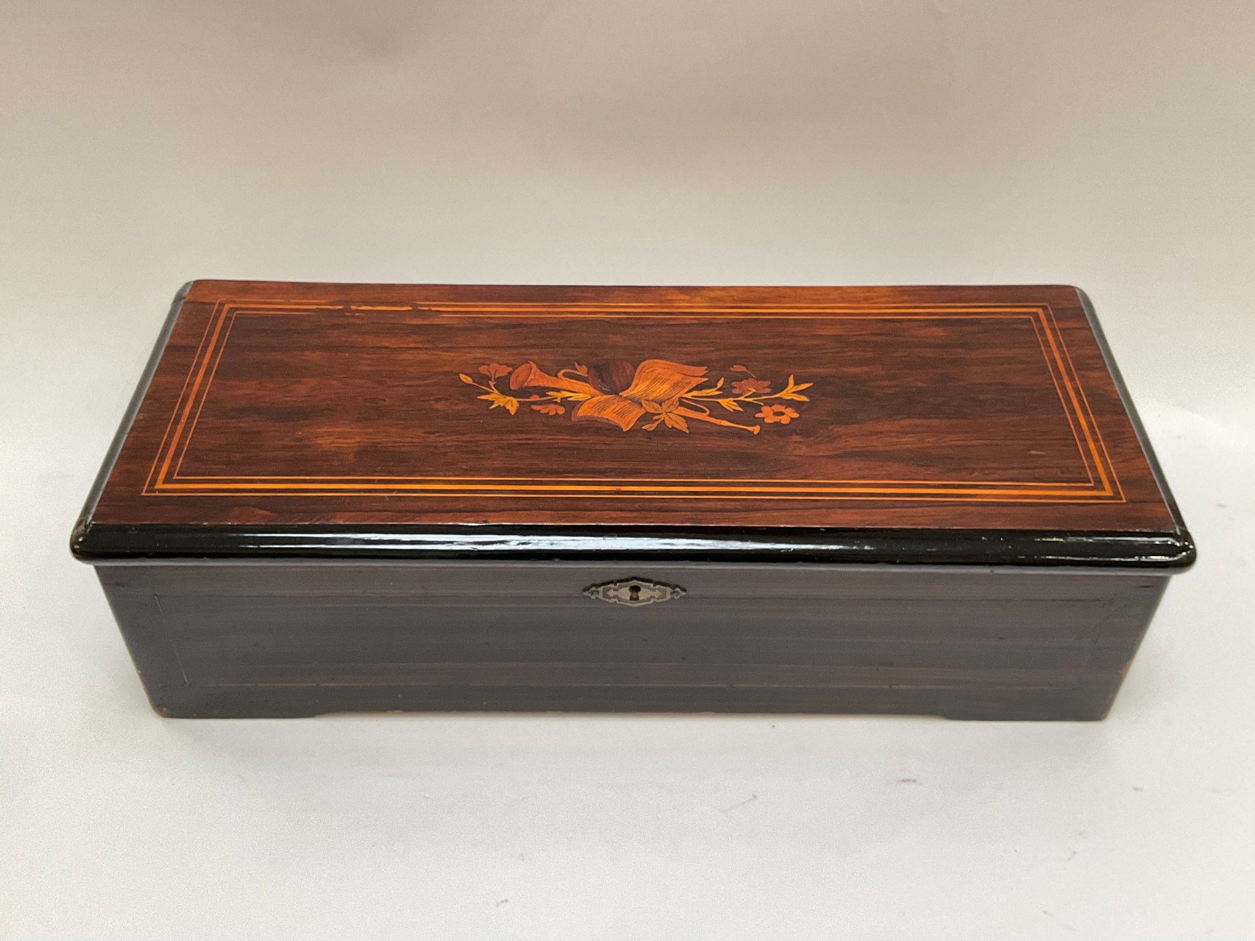 Large table-top musical box, late 19th/early 20th Century, lacquered wooden case, lid with