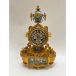 A 19th Century French ormolu and porcelain mantel clock with 8 day movement, Sevres style panels,