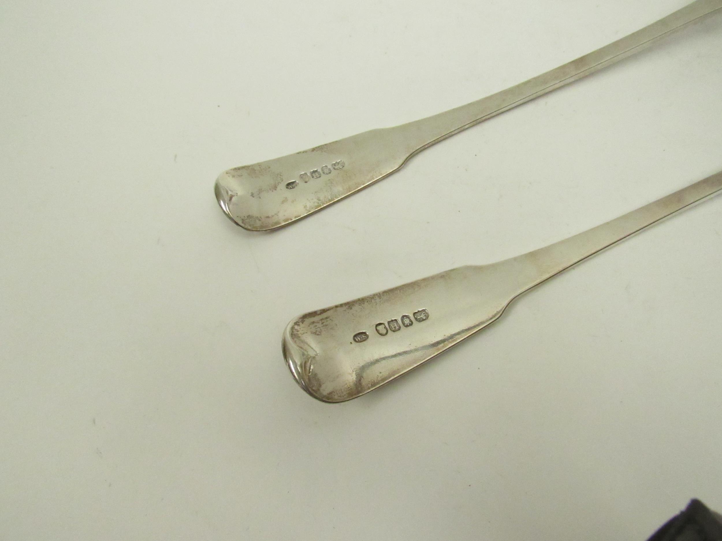 A pair of William Sumner I silver basting / stuffing spoons, family crest to terminal, London - Image 4 of 4