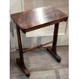 A Victorian rosewood side table with rounded rectangular top to turned spindle stretcher and