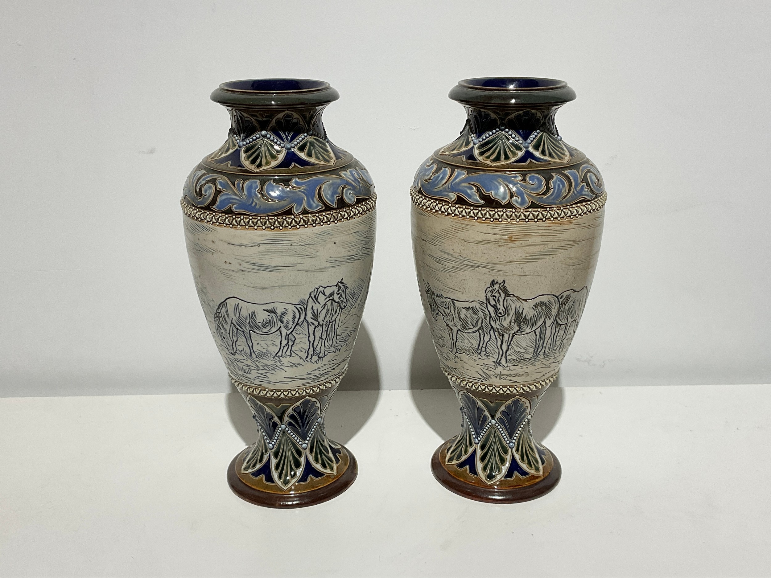 A pair of Doulton Lambeth vases incised by Hannah Barlow with sgraffito of gypsy ponies and