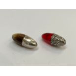 Two ovoid form scent bottles, one horn and silver, the other ruby glass and white metal,