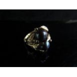 A double black cultured pearl ring in an ornate 14k gold mount. Size Q, 5.7g