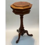 A late 19th Century octagonal top sewing table on twisted column to three outswept legs, 74cm tall