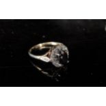 A 9ct gold diamond and sapphire ring with diamond set shoulders. Size P, 2.4g