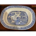 A 19th Century "U.H. & W." stoneware willow pattern meat platter with gravy well, 57cm x45cm