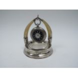 A silver pocket watch stand with Mother of Pearl fashioned horns, London 1907, weighted base and