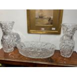 A pair of Czechoslovakian hand cut crystal vases, 33cm tall, and a oval shallow form dish, 43cm long