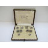 A set of unmarked platinum fronted dress studs and cufflinks the centre set with a cabochon sapphire