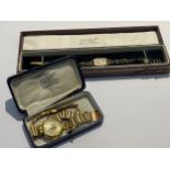 Two gold cased wristwatches, one an Avia lady's wristwatch, both with associated cases