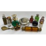 A collection of scent bottles including amber glass double-ended and gilt enriched, together with