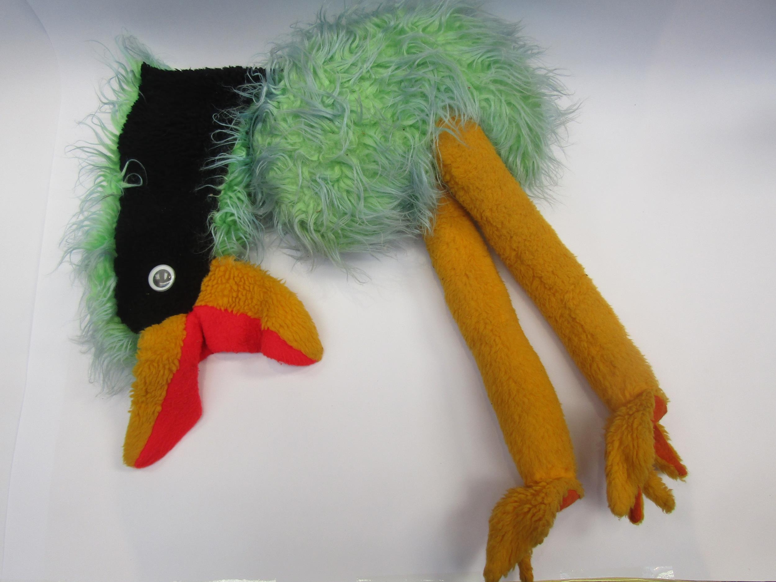 An emu soft toy with hand puppet head