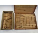 An early 20th Century wooden boxed set of interlocking Building Blocks together with a box of