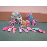 A collection of My Little Pony and similar figures together with a quantity of brushes and combs