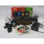 An Atari video computer game system with two joysticks, two paddles and games to include