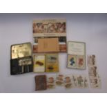 A collection of vintage card games and dominoes including The Motor Car Card Game and Snap