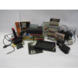 A ZX Spectrum computer games system with joystick, Alphacom 32 printer, various games and