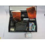 A Sinclair ZX spectrum in carry case with manuals, games and leads