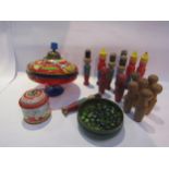 A tinplate spinning top and music box, vintage wooden skittles and a tin of modern marbles