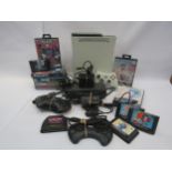 An unboxed X Box 360 computer games console together with assorted Sega Mega Drive games,