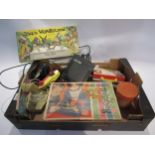 An assortment of vintage toys and games including Fisher Price radio, Spear's Alice in Wonderland