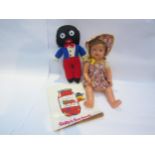 A soft filled golly, Golly's Fun Book and a vintage doll