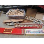 A collection of 1940's painted wooden ship construction toy blocks, bases, accessories and plans