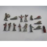 A colletion of playworn cast metal figures including military band members and Native American