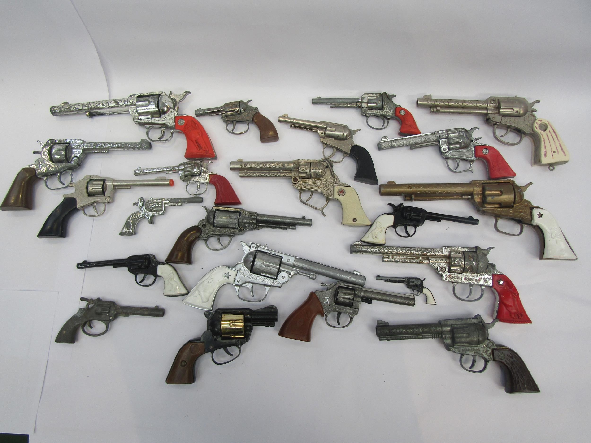 A collection of playworn toy guns, cap guns and pistols including Hubley, Lone Star, Wicke etc