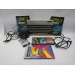 An Oric-1 computer with games and leads