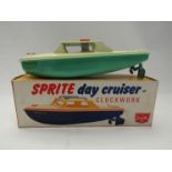 A boxed Sutcliffe Toy 'Sprite' Day Cruiser tinplate clockwork boat