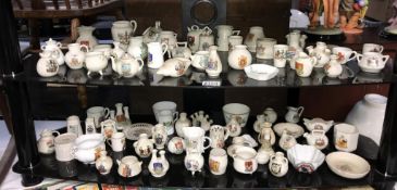A large quantity/good selection of crested china 2 shelves. Collect only.