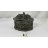 A mid 19th century lead tobacco box with compression lid.