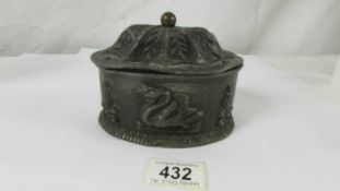 A mid 19th century lead tobacco box with compression lid.