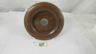 A David Linley walnut wine bottle coaster with sterling silver plaque. Diameter 16cm, inner diameter