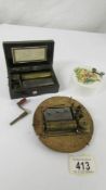 A Victorian musical movement, a Victorian music box and a vintage musical toy, all in working order.