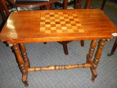 A mahogany table with inlaid chess board top.