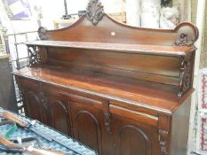 A four door, four drawer mahogany sideboard. Collect only.