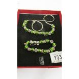 A Pandora necklace and bracelet with nine silver charms on each (925).