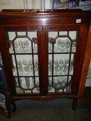 A two door mahogany astragal glazed display cabinet.