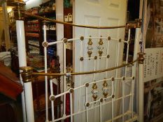 A good Victorian brass and iron bed with porcelain inserts, with side irons. Collect only.